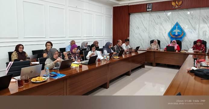 A group of women sitting at a desk AI-generated content may be incorrect.